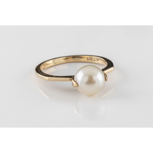 206 - a 9ct yellow gold pearl ring the 7.5mm pearl in a spinning setting, on a canted shank, ring size M, ... 