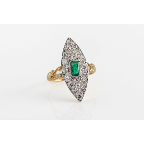 216 - An Edwardian 18ct yellow gold emerald and diamond navette shaped ring the central octagonal cut emer... 