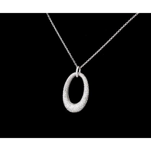 220 - A 9ct white gold and diamond pendant necklace the convex, elliptical pendant pavé set with brilliant... 