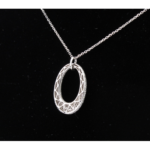 220 - A 9ct white gold and diamond pendant necklace the convex, elliptical pendant pavé set with brilliant... 