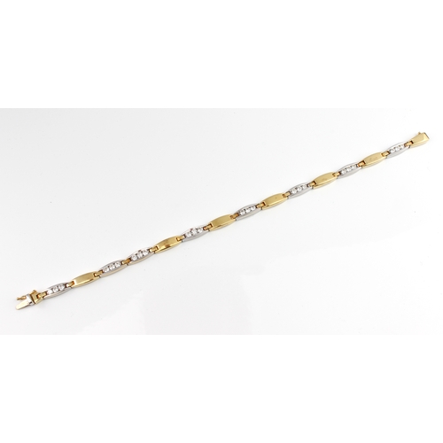 288 - An 18ct two-colour gold and diamond bracelet marked '750', the pierced, white gold links each set wi... 