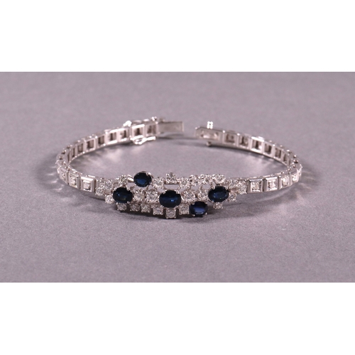 306 - A sapphire and diamond bracelet 18ct white gold set with brilliant cut white diamonds 2.35ct. approx... 