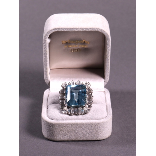 312 - An aquamarine and diamond set cluster ring comprising a single aquamarine surrounded by baguette and... 