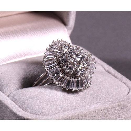 317 - An important diamond cluster ballerina dress ring set with approx 6 cts of fine brilliant and baguet... 