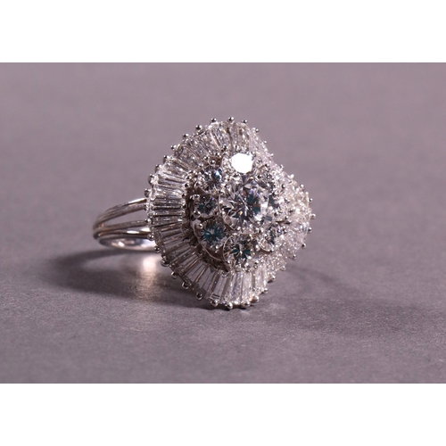 317 - An important diamond cluster ballerina dress ring set with approx 6 cts of fine brilliant and baguet... 