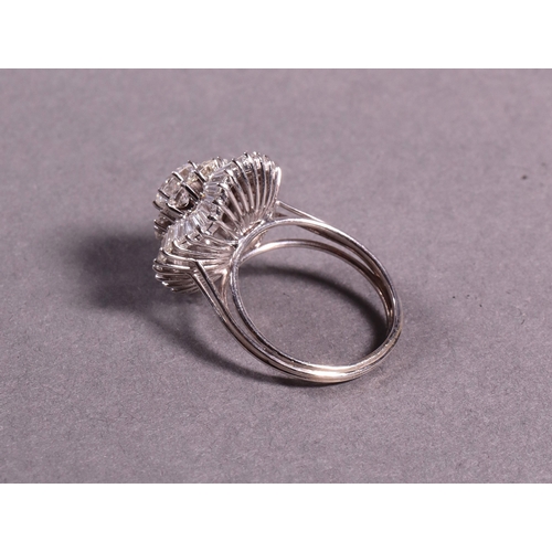 317 - An important diamond cluster ballerina dress ring set with approx 6 cts of fine brilliant and baguet... 