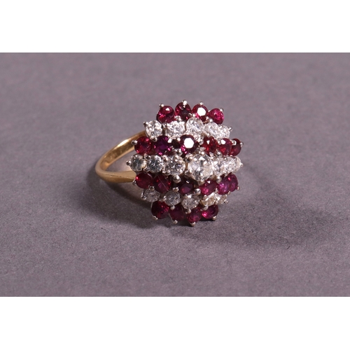 318 - A ruby and diamond cluster dress ring approx. 1.37ct diamonds, set in white and yellow gold.