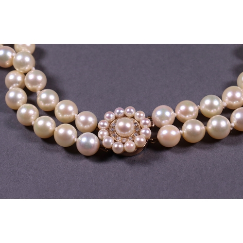 324 - A two row pearl necklet with a 9ct gold and diamond clasp.