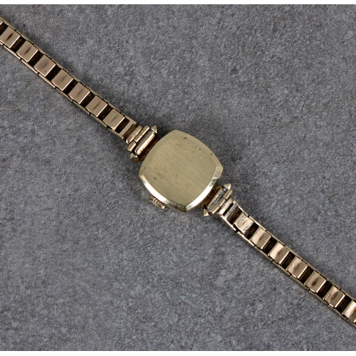 353 - A ladies gold Tissot wrist watch the small convex sided square face with baton hour markers on 9ct g... 