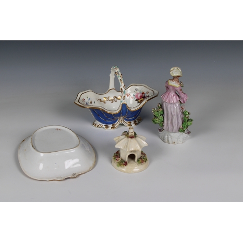 365 - A small collection of antique ceramics to include a Continental figure of a lady, standing against a... 