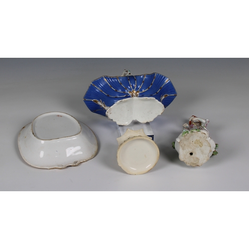 365 - A small collection of antique ceramics to include a Continental figure of a lady, standing against a... 