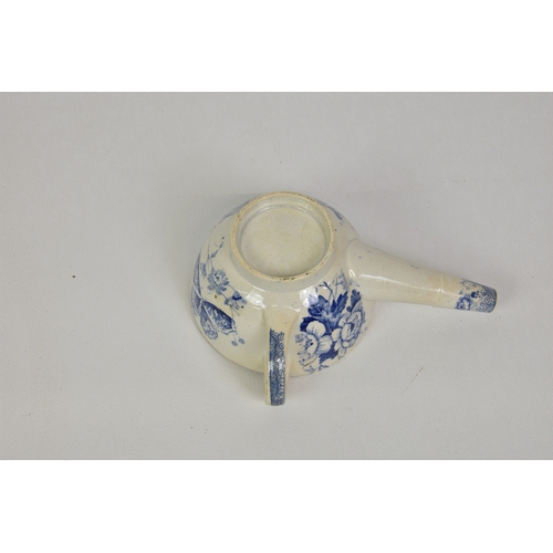 368 - An antique blue and white transfer ware invalid feeding cup partially covered and a long spout, the ... 