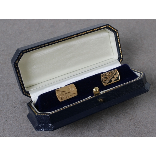 37 - A pair of 9ct gold cufflinks of rounded rectangular form with sprung bar fixings, each engraved with... 