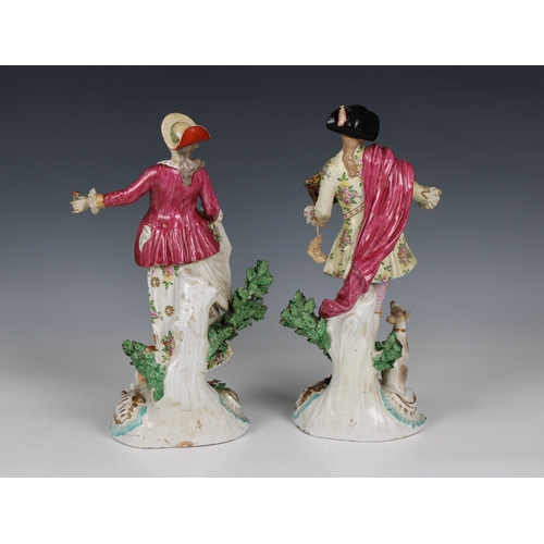 370 - A pair of Samson of Paris porcelain figures the man wearing a tricorn hat carrying a basket of roses... 