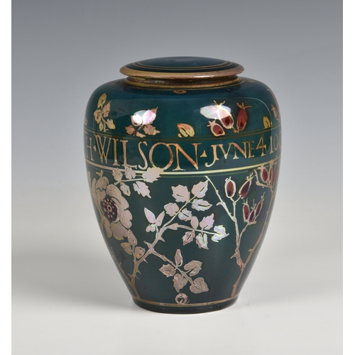 385 - Gordon Forsyth for Pilkington, a Royal Lancastrian ovoid lustre vase and cover, 1909, painted with f... 