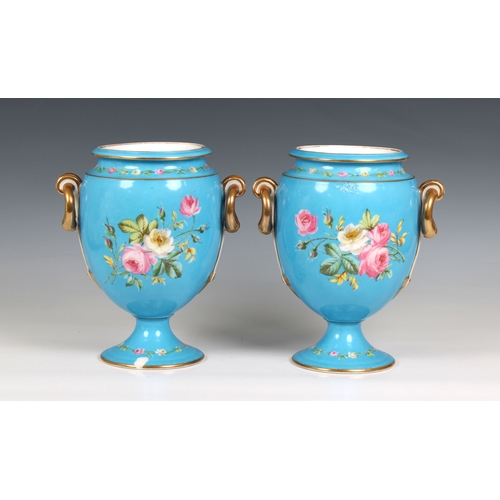 402 - A pair of 20th century blue porcelain vases each urn-form vase decorated with a romantic scene with ... 