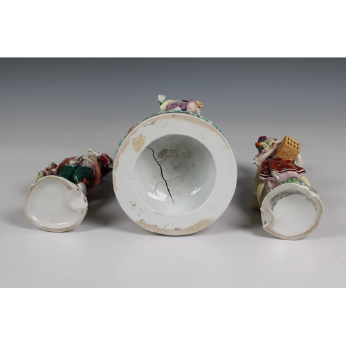 404 - A pair of Continental porcelain figures of a man carrying a bird and a woman carrying a bird cage, g... 