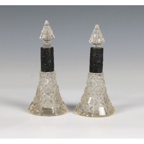 420 - A pair of cut glass silver mounted scent bottles with cut glass stoppers, 5½in. (14cm.) high.