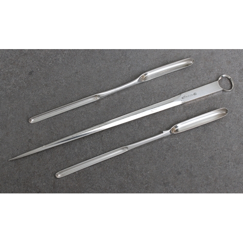 483 - Two silver plated double ended marrow scoops 8 7/8in. (22.7cm.) long, together with a plated skewer.... 