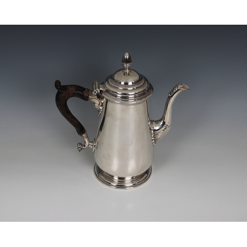 485 - A Georgian silver coffee pot indistinct hallmarks, having a plain conical body and domed hinged lid ... 