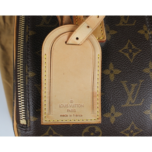 652 - A Louis Vuitton monogrammed travel case having monogrammed printed canvas, front zip pocket, full zi... 