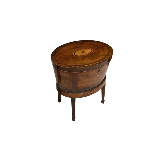 670 - A Regency oval inlaid mahogany and marquetry wine cooler the oval crossbanded top with central fan p... 