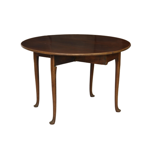 734 - A late 18th century mahogany oval drop-flap supper table the top with D-end drop flaps over a plain ... 