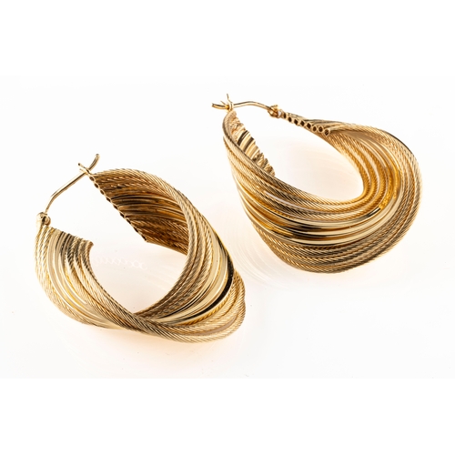 9 - A pair of 14ct yellow gold earrings comprising nine rope twist and plain strands, in a twisted forma... 