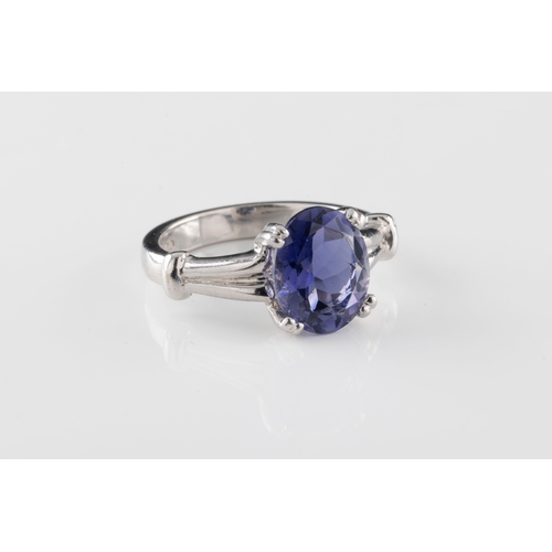 90 - A 9ct white gold and tanzanite solitaire ring the oval cut tanzanite claw set in a raised mount, rin... 