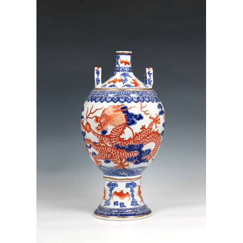 1176 - A 19th century Chinese porcelain vase the ovoid body with rouge de feu and blue decoration of dragon... 