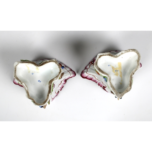 386 - A pair of Bow porcelain sweetmeat stands circa 1765 in the form of upturned scallop shells nestled o... 