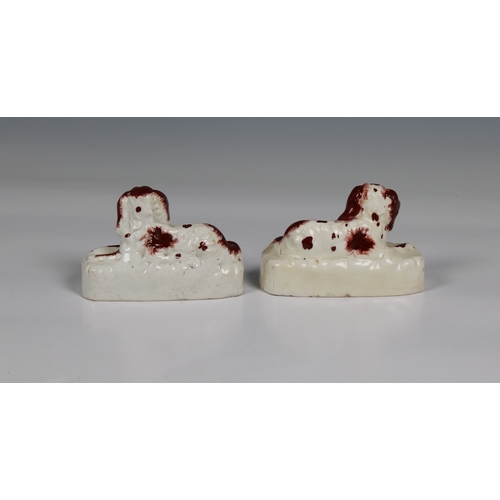 388 - A pair of early 19th century Staffordshire porcelain King Charles spaniels incorporating quill holde... 