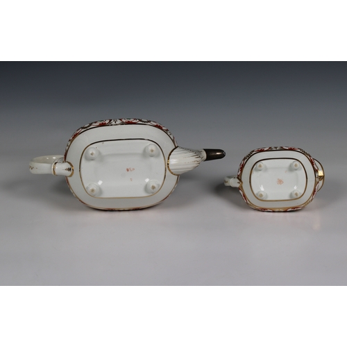 409 - A Derby porcelain tea pot and milk jug circa 1820, the tea pot with a silver spout factory mark bene... 