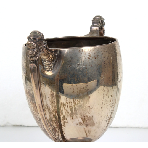 554 - A silver twin handled trophy cup Adie Brothers Ltd, Birmingham, 1928, the handles with lion mask dec... 