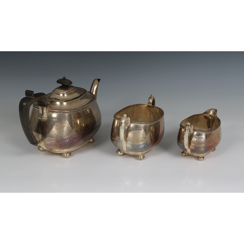 531 - A three piece silver tea service Harrison Brothers & Howson, Sheffield, 1919, of oval bellied form, ... 