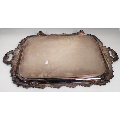 460 - A late 19th century silver plated two handled rectangular tray engraved scrolling decoration, applie... 