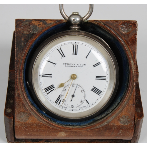 331 - A silver 'Symon's and Sons Launceston' pocket watch 1 7/8 (5.7cm.) diameter, with key, contained in ... 