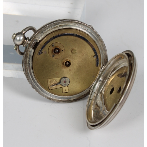 331 - A silver 'Symon's and Sons Launceston' pocket watch 1 7/8 (5.7cm.) diameter, with key, contained in ... 