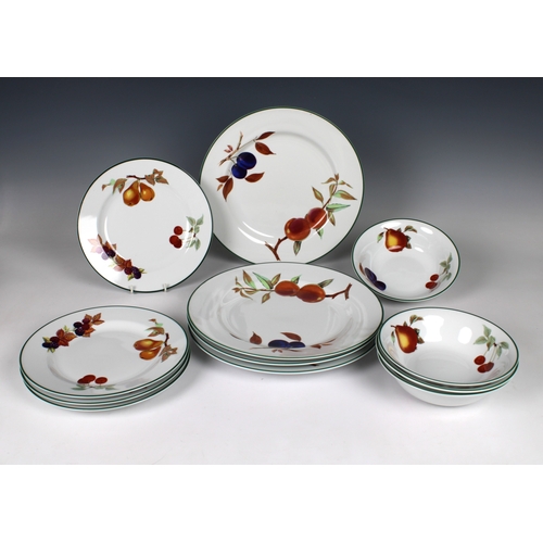 102 - A collection of Royal Worcester Evesham pattern dinner ware to include a pair of biscuit barrels wit... 