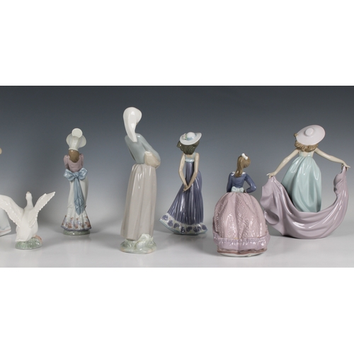 104 - A collection of boxed Lladro figurines to include 866 Girl with puppy and goose; 7636 Girl with umbr... 