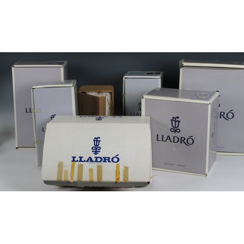 104 - A collection of boxed Lladro figurines to include 866 Girl with puppy and goose; 7636 Girl with umbr... 