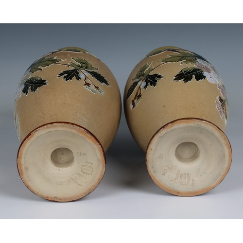 109 - A matched pair of Doulton Lambeth Slater's Patent vases of baluster form typically decorated with fl... 