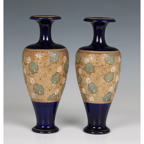 110 - A pair of Doulton Lambeth Slater's Patent vases of shouldered ovoid form with slender necks and ever... 