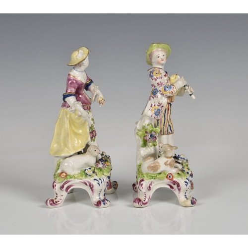 116 - A pair of Bow porcelain figures of a shepherd and shepherdess late 18th century, the shepherd holdin... 