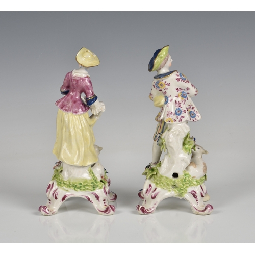 116 - A pair of Bow porcelain figures of a shepherd and shepherdess late 18th century, the shepherd holdin... 