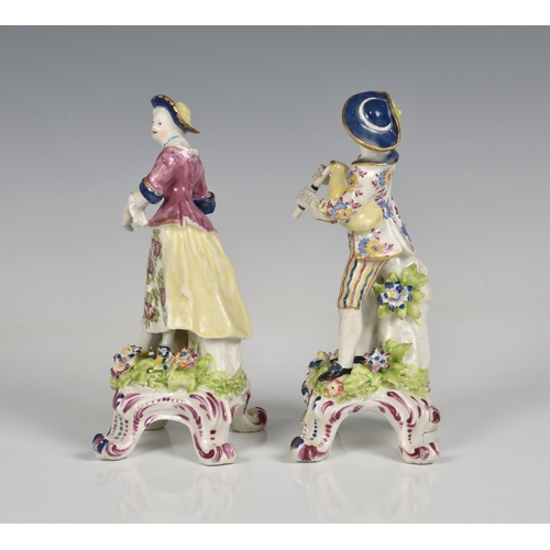 116 - A pair of Bow porcelain figures of a shepherd and shepherdess late 18th century, the shepherd holdin... 