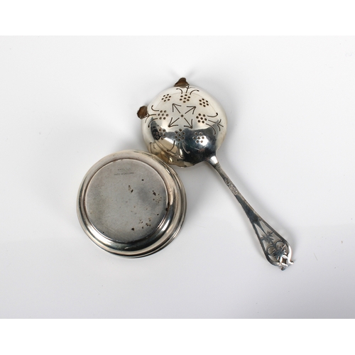 127 - An early Elizabeth II silver strainer and stand Viners Ltd, Sheffield, 1953/54, the strainer spoon w... 