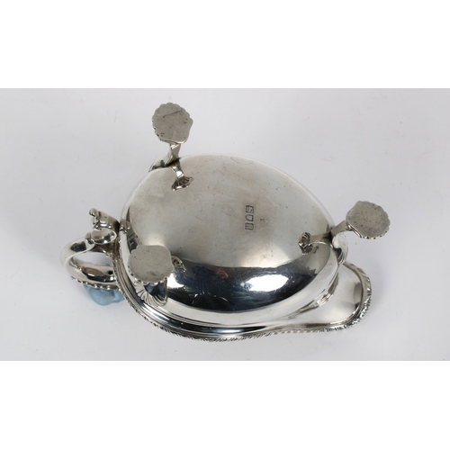 135 - An Edwardian silver sauce boat C.S Harris & Sons Ltd, London, 1908, leaf capped scroll handle, gadro... 