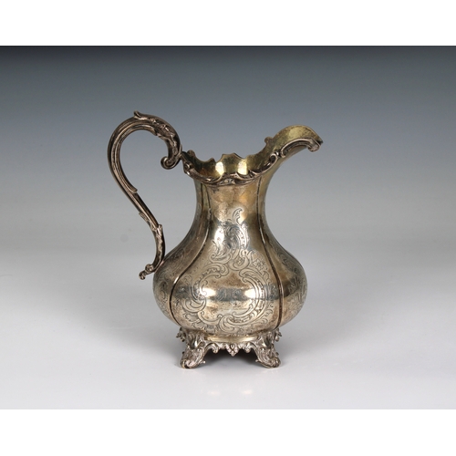 155 - A Victorian silver baluster cream / milk jug Charles Reily & George Storer, London, 1843, of lobed f... 