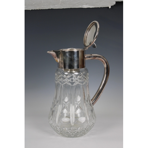 169 - A 20th century clear cut glass water jug with silver plated lid and handle of large proportions, inc... 